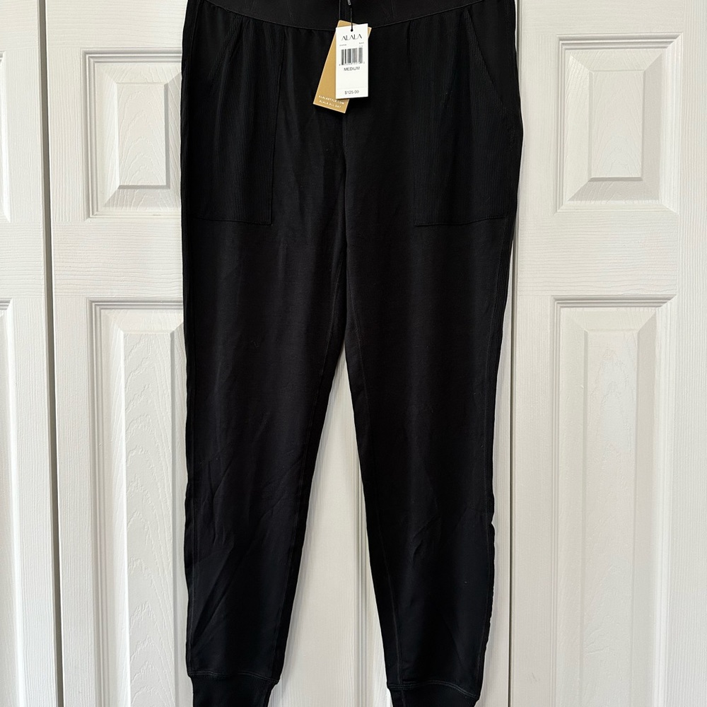 NWT Alala women’s soft joggers with ribbed details